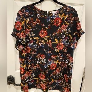 Short sleeved floral blouse.